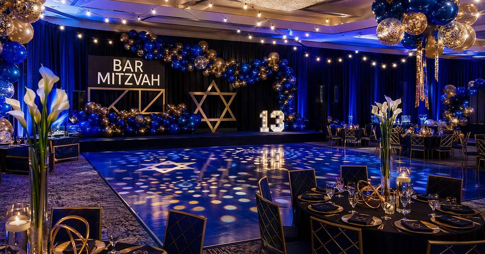 A bar mitzvah reception hall lit in blue and gold before the guests arrive