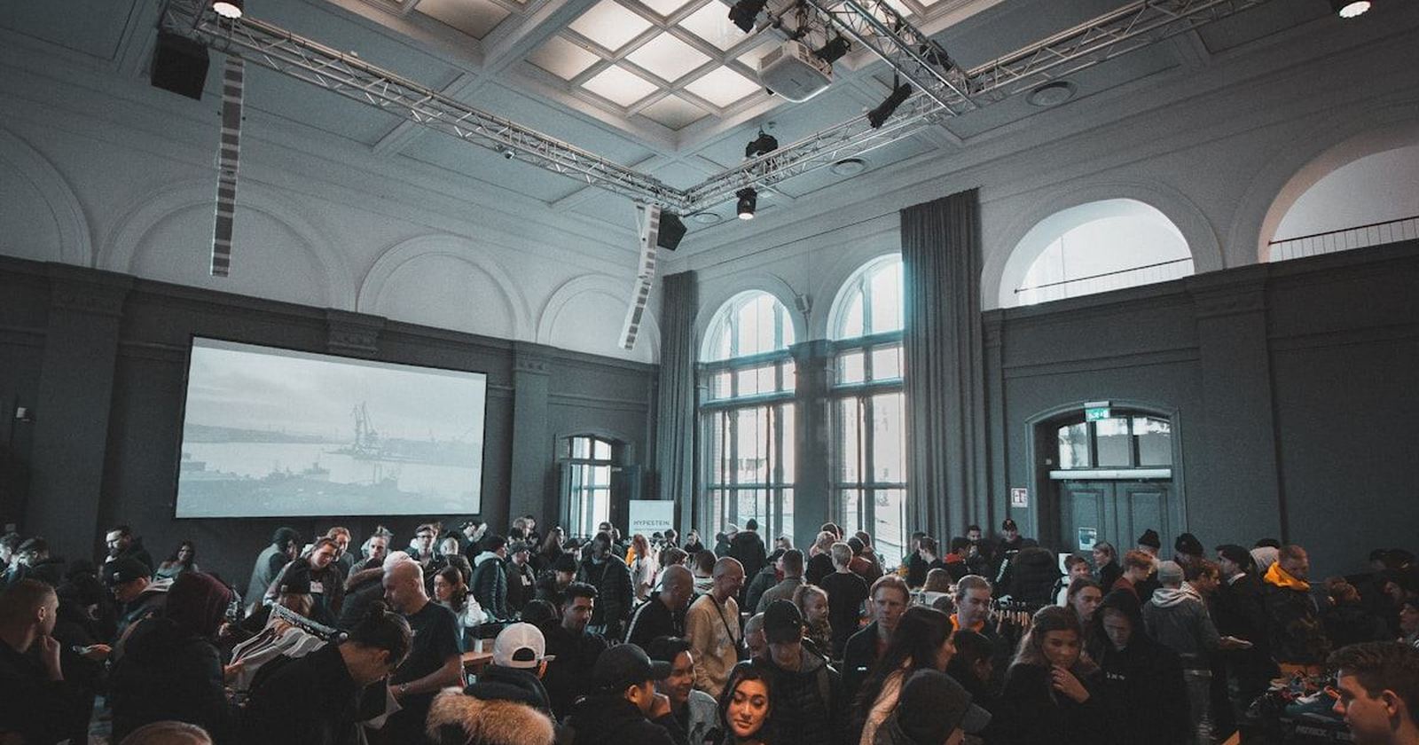 A large formal event hall filled with guests before the celebration begins